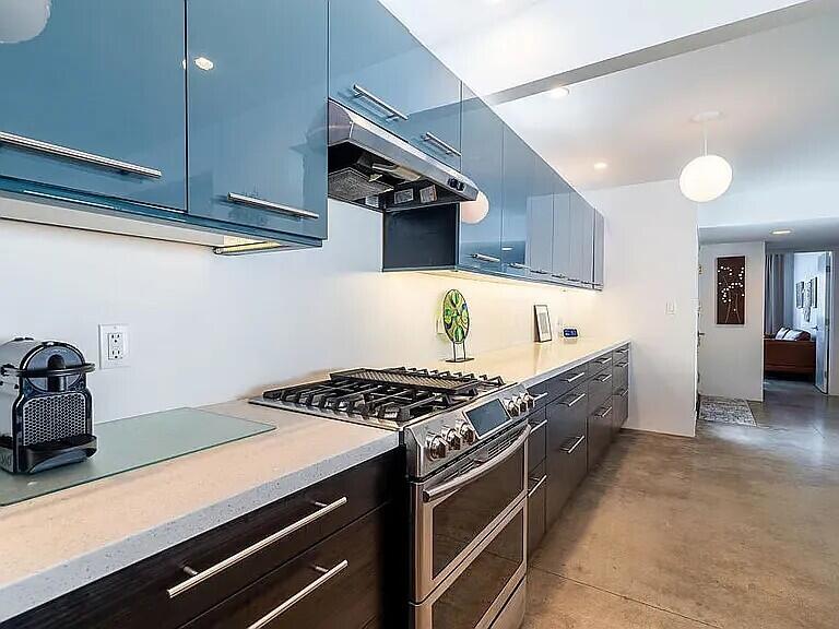 2223 North Magnolia Road Palm Springs, CA 92262 - Photo 16 of 28 a kitchen with stainless steel appliances a stove a sink and cabinets