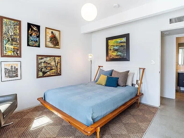 2223 North Magnolia Road Palm Springs, CA 92262 - Photo 18 of 28 a bedroom with a bed and painting on the wall