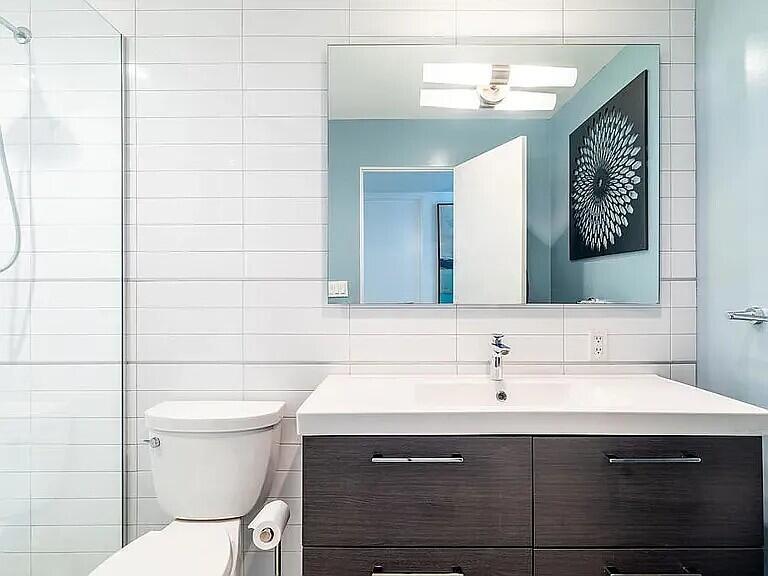 2223 North Magnolia Road Palm Springs, CA 92262 - Photo 20 of 28 a bathroom with a sink mirror vanity and toilet