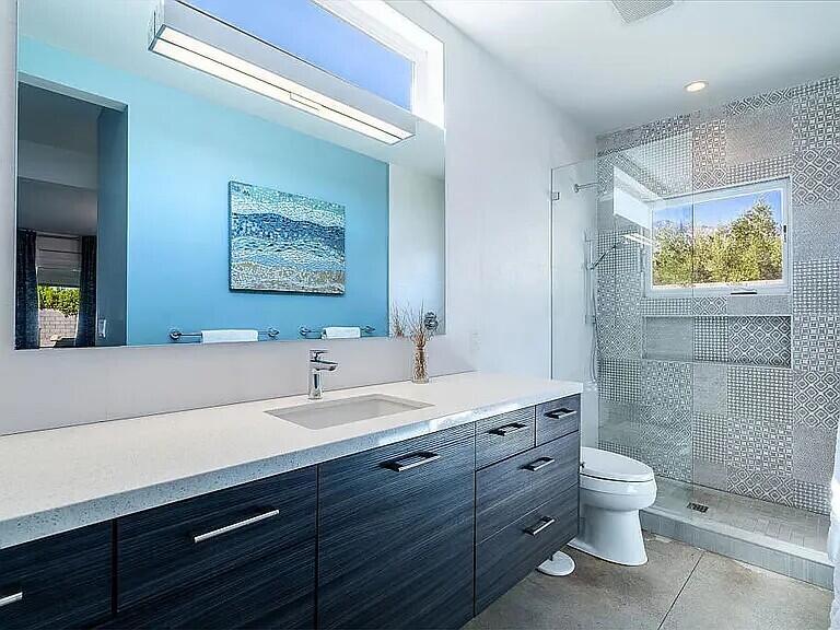 2223 North Magnolia Road Palm Springs, CA 92262 - Photo 23 of 28 a bathroom with a toilet a sink and mirror