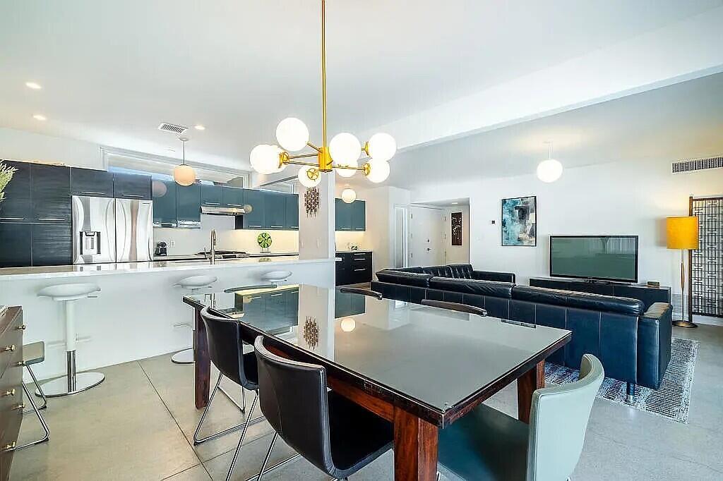 2223 North Magnolia Road Palm Springs, CA 92262 - Photo 10 of 28 a kitchen with a table and chairs in it