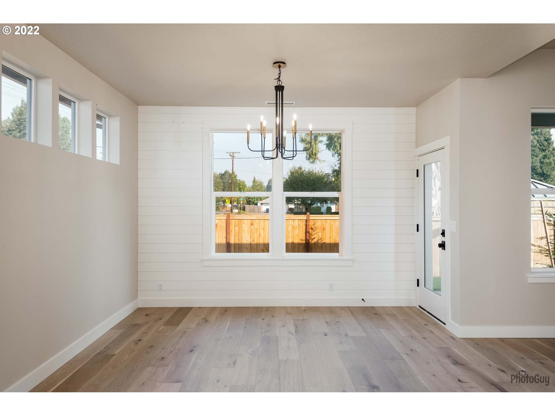 1011 South 33rd Springfield, OR 97478 - Photo 13 of 32 a view of an room with wooden floor chandelier and windows