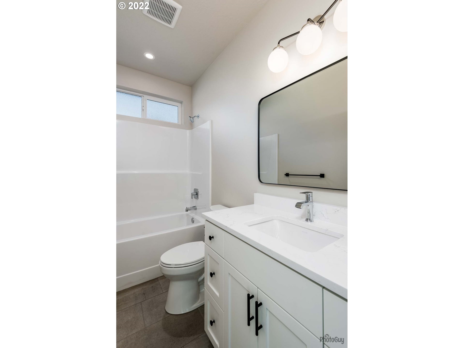 1011 South 33rd Springfield, OR 97478 - Photo 26 of 32 a bathroom with a sink a toilet and a mirror