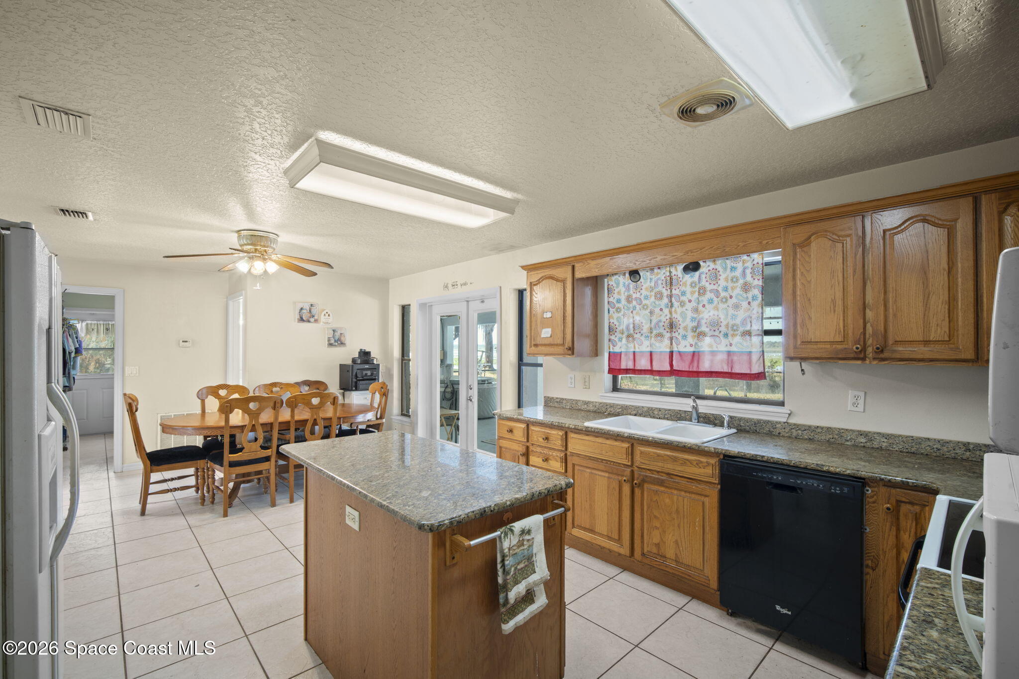 130 North Carpenter Road Titusville, FL 32796 - Photo 17 of 30 Kitchen/view of Patio French Doors