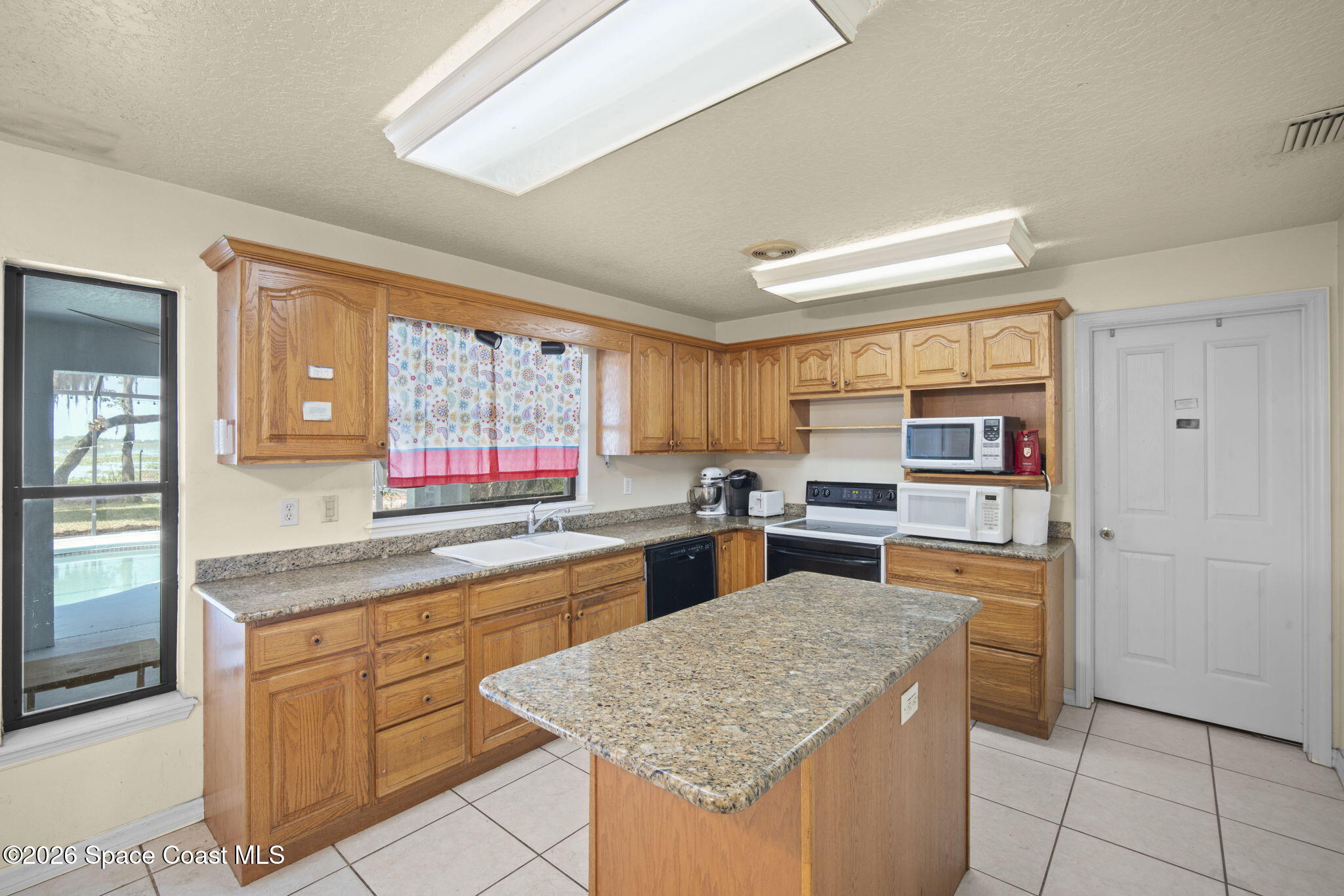 130 North Carpenter Road Titusville, FL 32796 - Photo 19 of 30 Kitchen sink/Stove