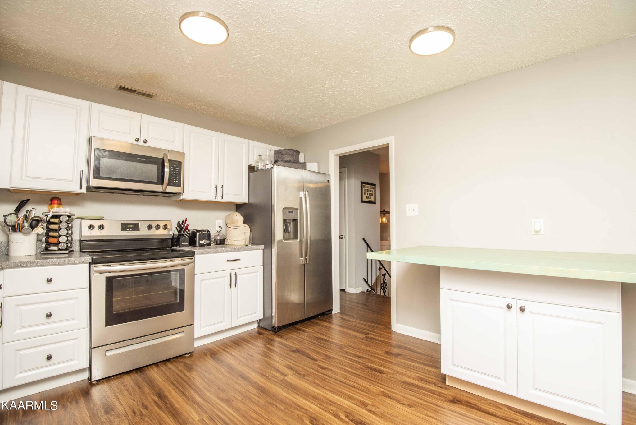 233 Geronimo Road Knoxville, TN 37934 - Photo 11 of 40 a kitchen with a stove a sink and a refrigerator