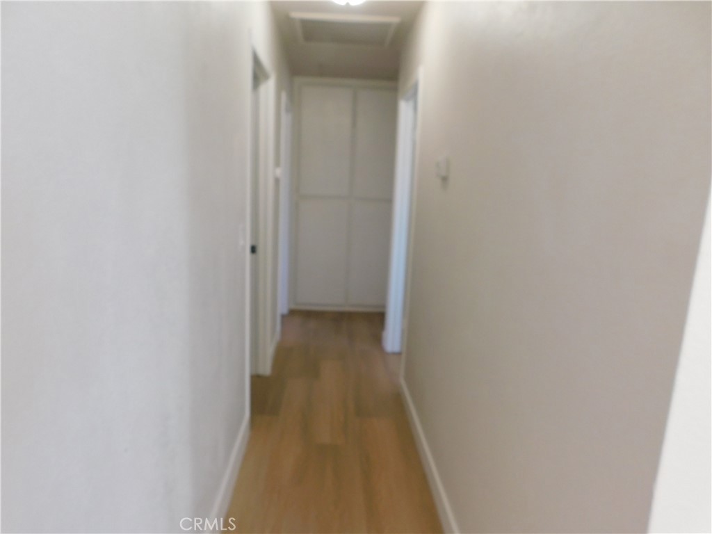 10456 Napa Road Adelanto, CA 92301 - Photo 15 of 31 a view of a room with wooden floor