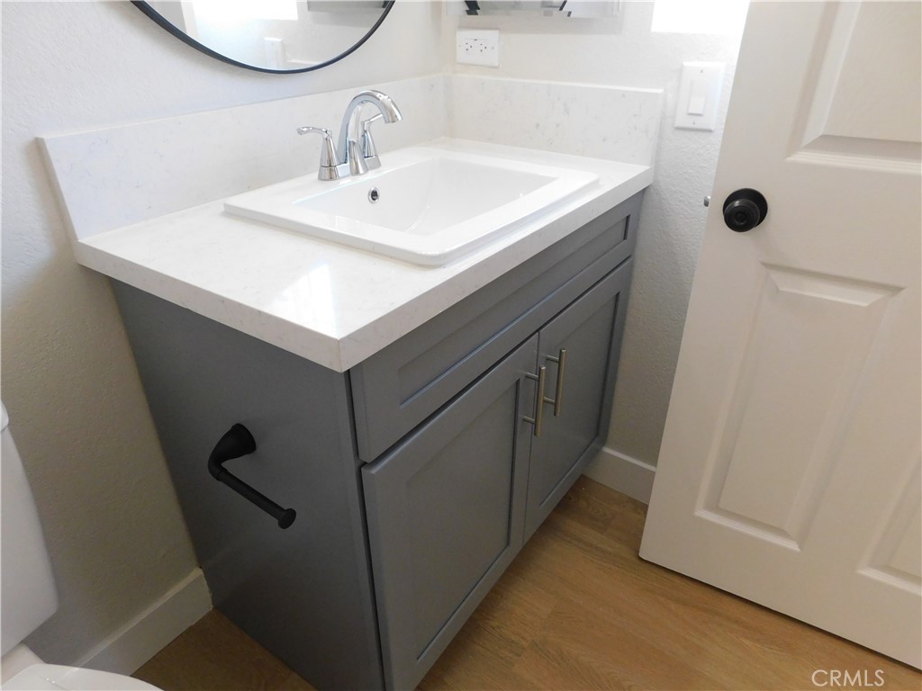 10456 Napa Road Adelanto, CA 92301 - Photo 21 of 31 a bathroom with a sink and a mirror