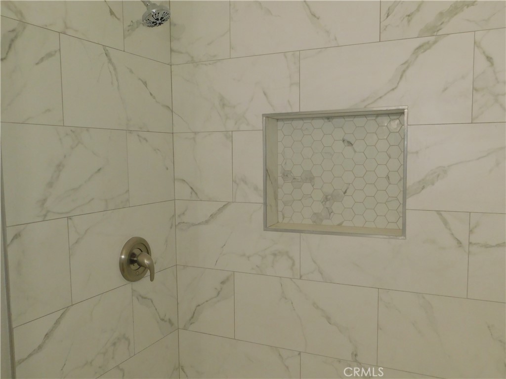 10456 Napa Road Adelanto, CA 92301 - Photo 24 of 31 a bathroom with a shower