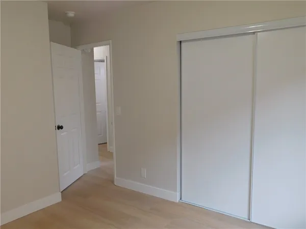 a view of a hallway with closet