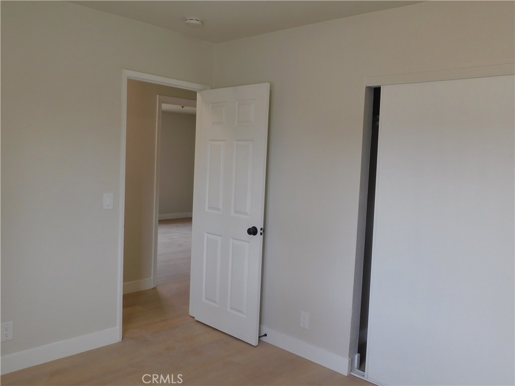 10456 Napa Road Adelanto, CA 92301 - Photo 26 of 31 a view of a hallway with closet