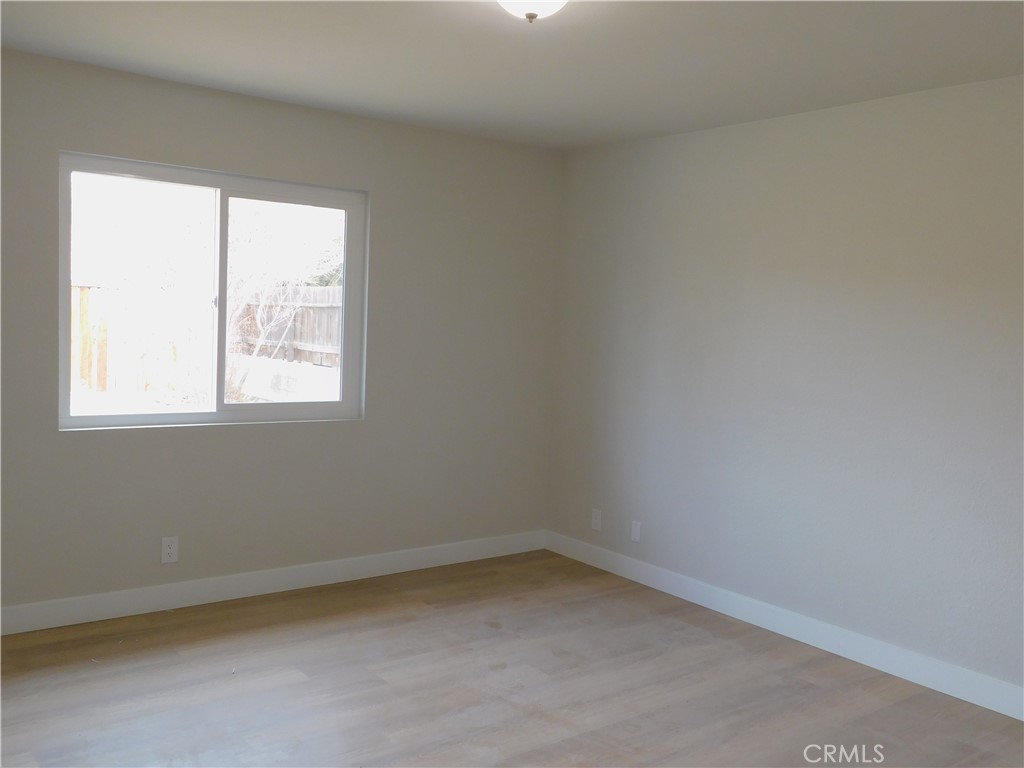 10456 Napa Road Adelanto, CA 92301 - Photo 27 of 31 an empty room with a window