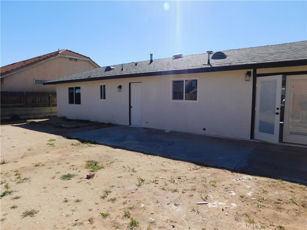10456 Napa Road Adelanto, CA 92301 - Photo 30 of 31 a view of a house with a yard