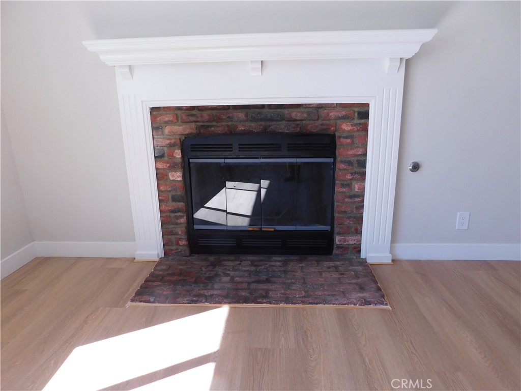 10456 Napa Road Adelanto, CA 92301 - Photo 6 of 31 a living room with a fireplace