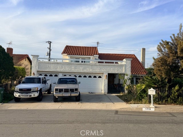 1710 Loma Road Montebello, CA 90640 - Photo 1 of 7 a car parked in front of a building