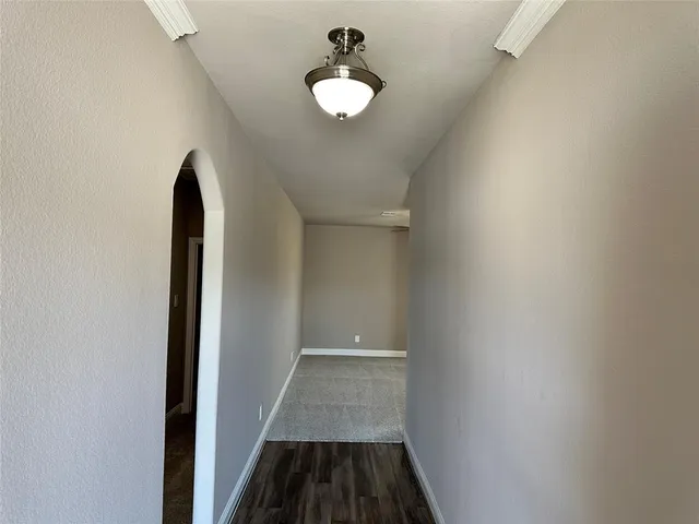 wooden floor in an empty room with closet