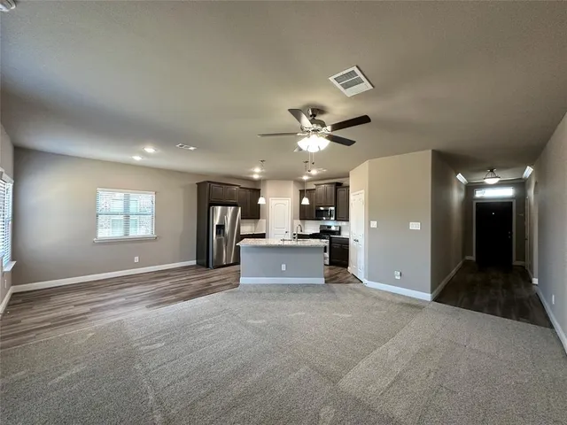 a view of a livingroom with a furniture