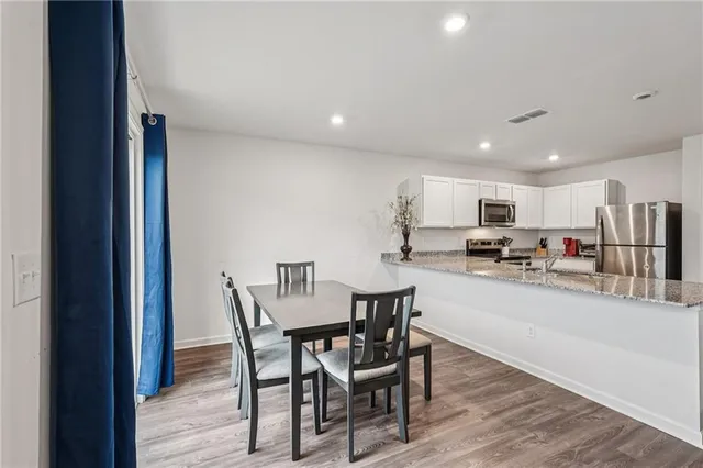 a view of a dining room with furniture