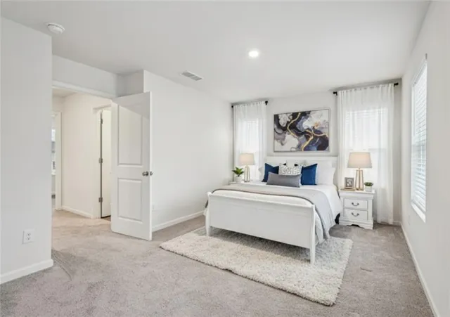 a view of bedroom with furniture and window