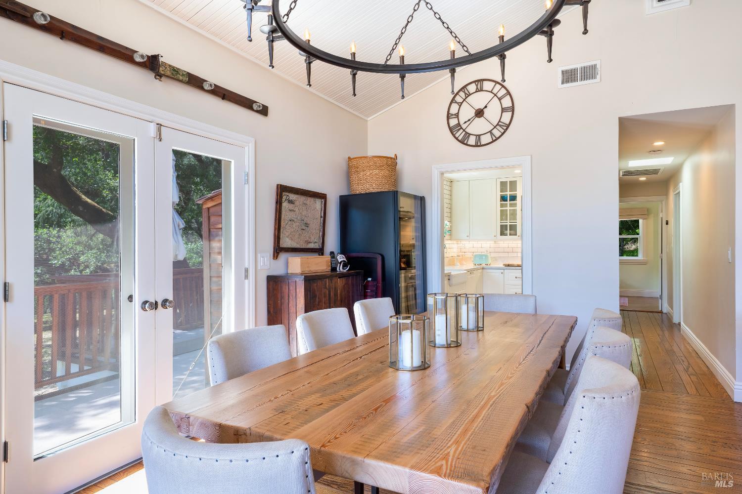 5270 Dry Creek Road Napa, CA 94558 - Photo 12 of 56 a view of a dining room with furniture large window wooden floor and a rug