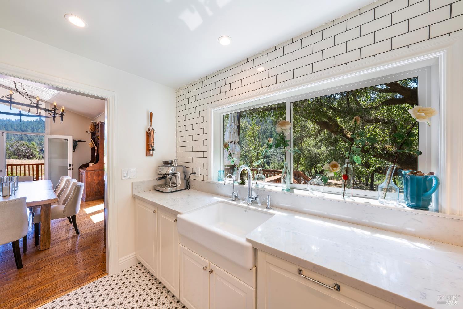 5270 Dry Creek Road Napa, CA 94558 - Photo 16 of 56 a bathroom with a sink and a large window