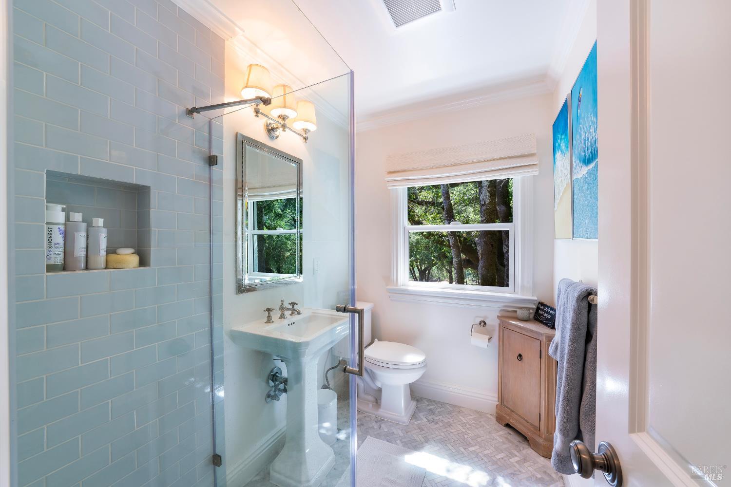 5270 Dry Creek Road Napa, CA 94558 - Photo 22 of 56 a bathroom with a double vanity sink a toilet and a mirror