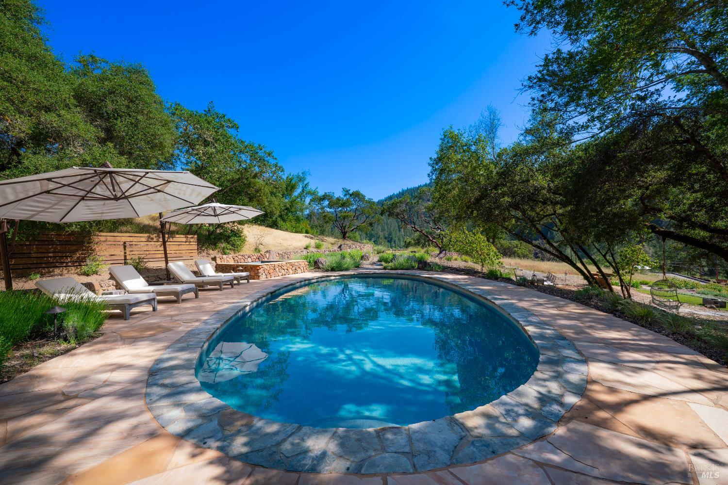 5270 Dry Creek Road Napa, CA 94558 - Photo 23 of 56 a view of a swimming pool with a patio
