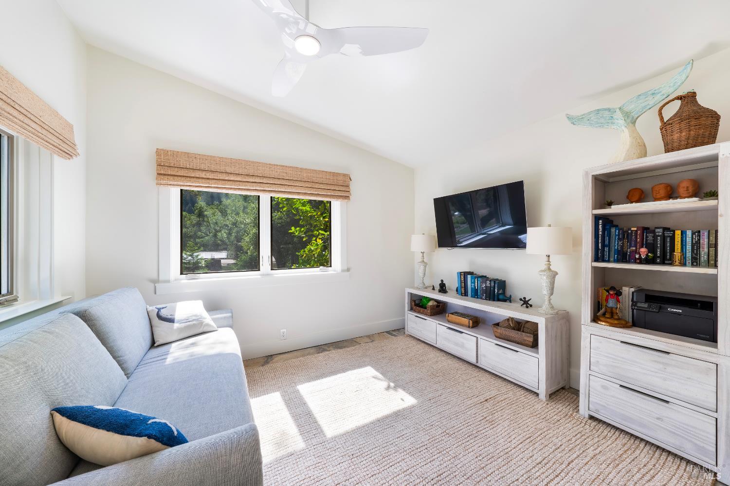 5270 Dry Creek Road Napa, CA 94558 - Photo 28 of 56 a living room with furniture and a flat screen tv