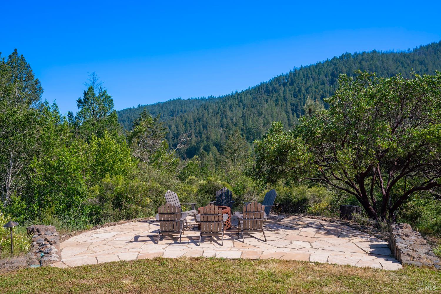 5270 Dry Creek Road Napa, CA 94558 - Photo 40 of 56 a view of a lake with a bench