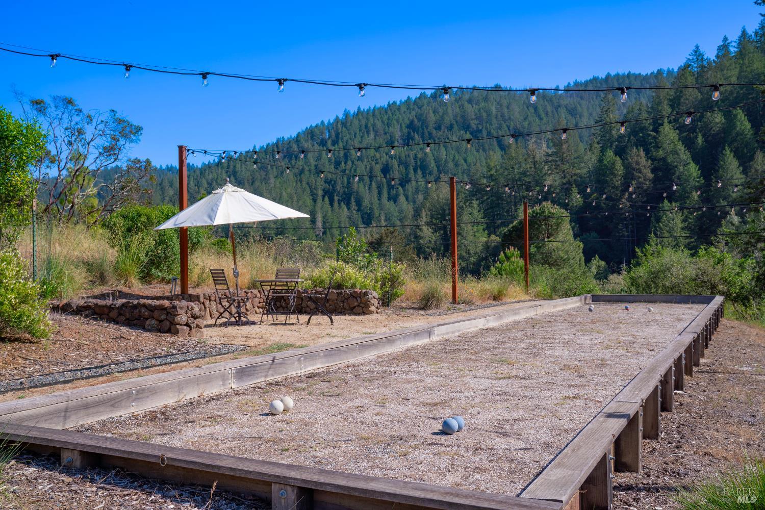 5270 Dry Creek Road Napa, CA 94558 - Photo 53 of 56 an outdoor space with furniture and umbrella