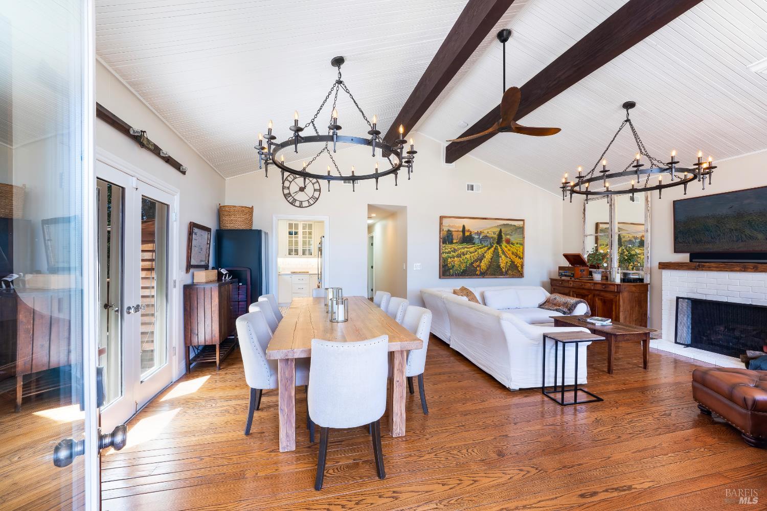 5270 Dry Creek Road Napa, CA 94558 - Photo 7 of 56 a view of a dining room with furniture wooden floor and chandelier