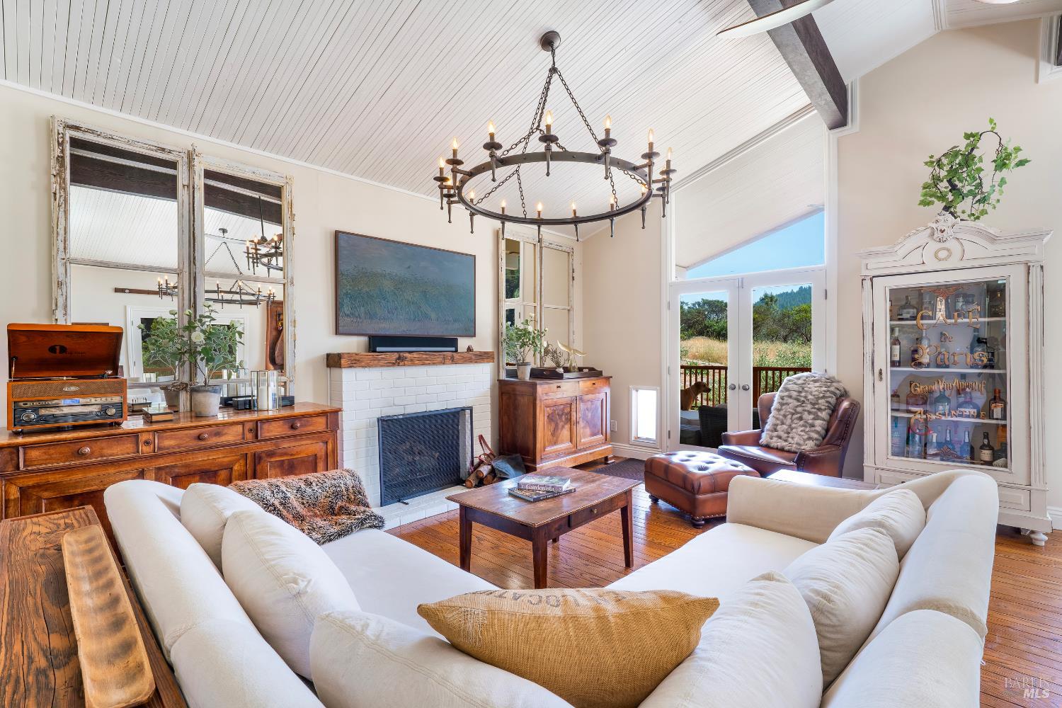 5270 Dry Creek Road Napa, CA 94558 - Photo 10 of 56 a living room with furniture a fireplace and a flat screen tv