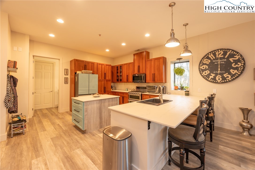 1390 Ransey Woodring Road Todd, NC 28684 - Photo 13 of 48 a kitchen with a table and chairs in it