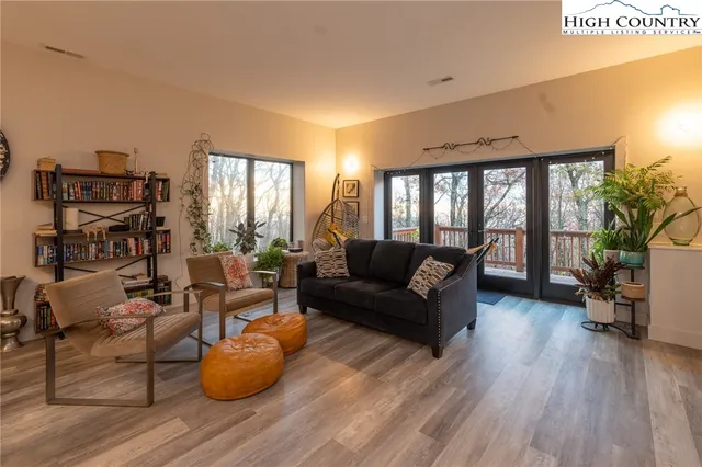 a view of balcony with wooden floor and fence