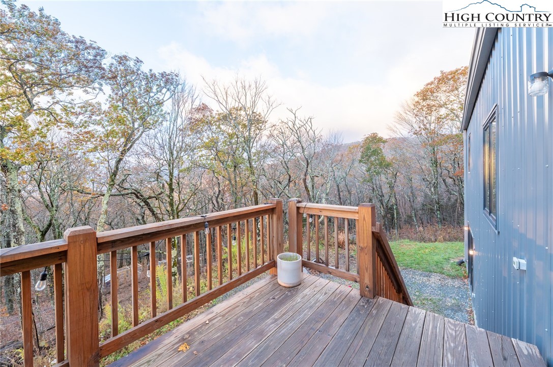 1390 Ransey Woodring Road Todd, NC 28684 - Photo 18 of 48 a view of balcony with wooden floor and fence