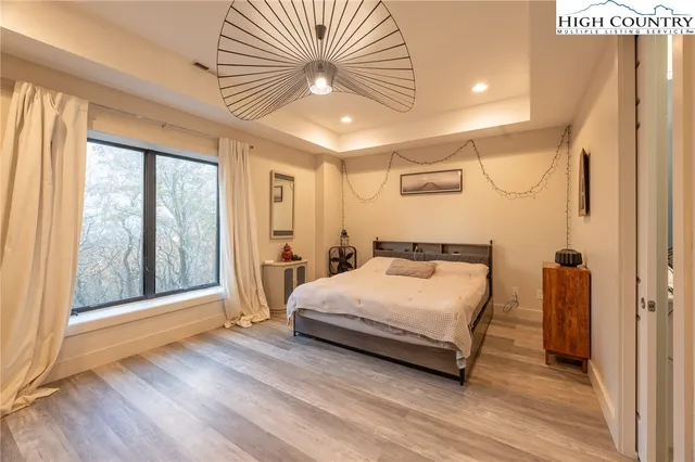 a bathroom with a sink a window and a mirror