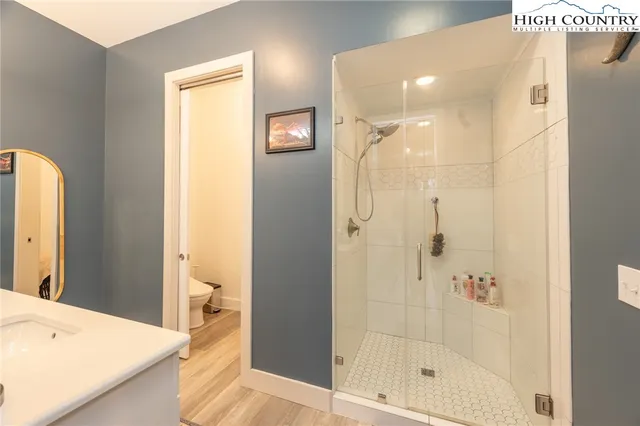 a bedroom with a bed window and couch