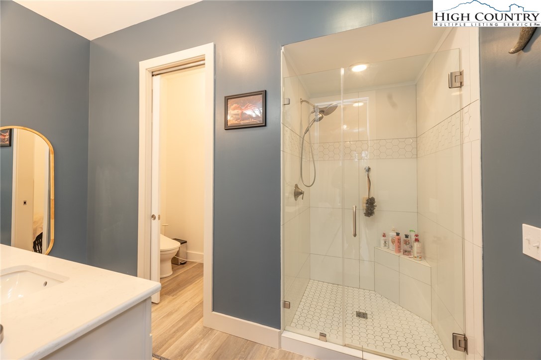 1390 Ransey Woodring Road Todd, NC 28684 - Photo 20 of 48 a bathroom with a shower and a sink