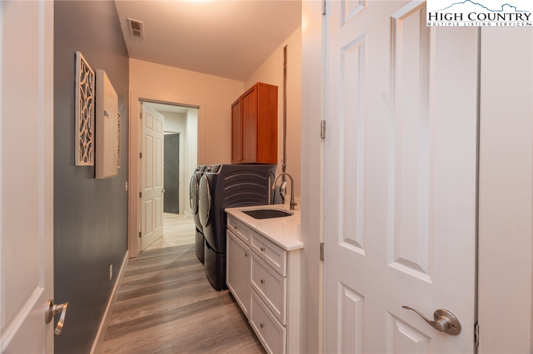 1390 Ransey Woodring Road Todd, NC 28684 - Photo 23 of 48 a bathroom with a sink a window and a mirror