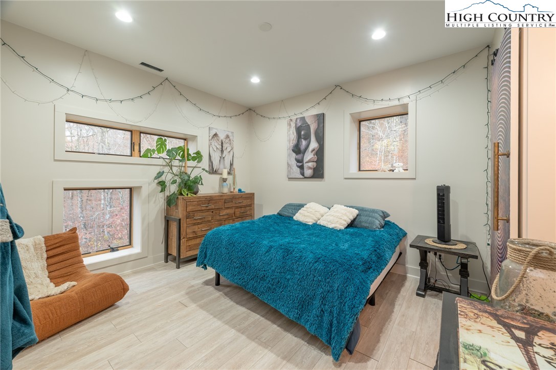 1390 Ransey Woodring Road Todd, NC 28684 - Photo 24 of 48 a bedroom with a bed window and couch