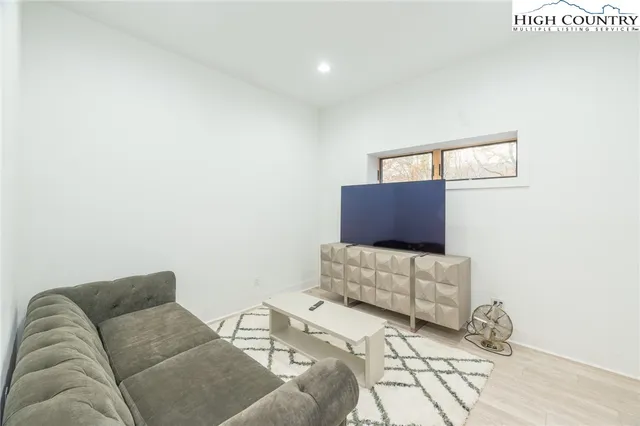 a white toilet sitting next to a shower curtain