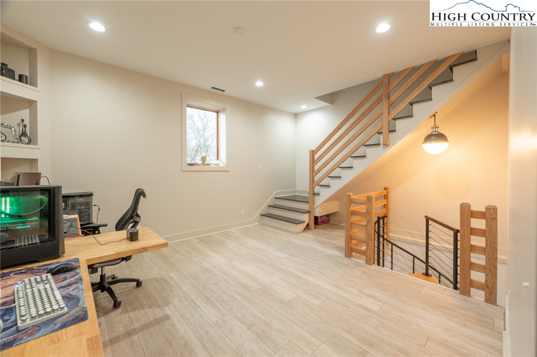 1390 Ransey Woodring Road Todd, NC 28684 - Photo 27 of 48 a view of a workspace with furniture and a window