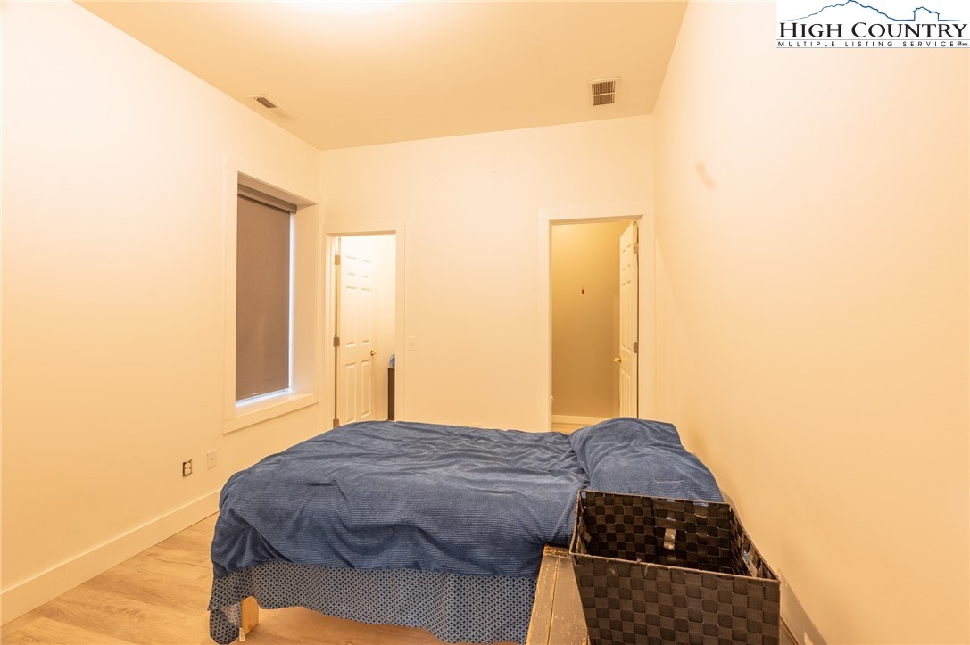 1390 Ransey Woodring Road Todd, NC 28684 - Photo 29 of 48 a bedroom with a bed and a window