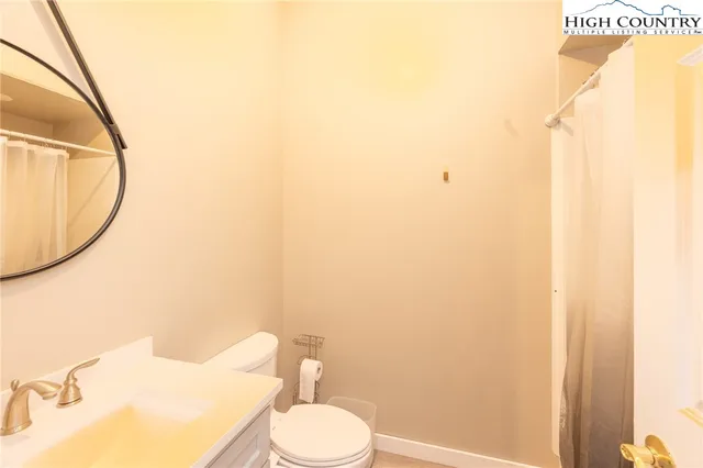 a backyard of a house with large trees