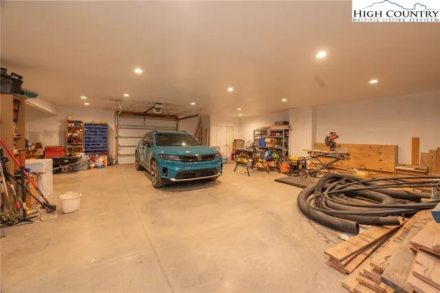 a view of a chair and table in backyard