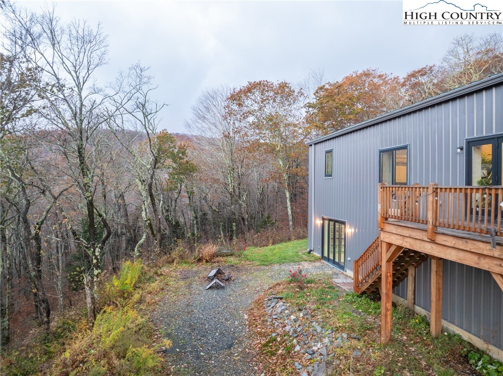 1390 Ransey Woodring Road Todd, NC 28684 - Photo 38 of 48 a view of a chair and table in backyard