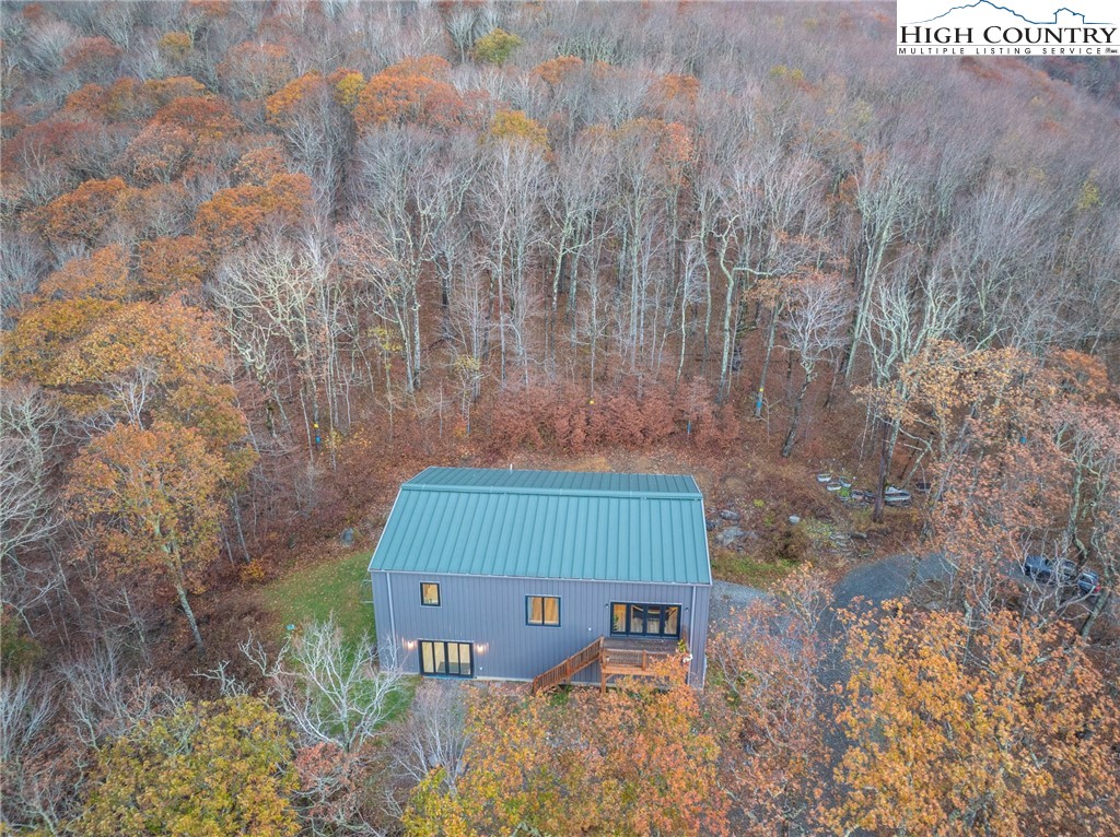 1390 Ransey Woodring Road Todd, NC 28684 - Photo 41 of 48 a view of a bench in a garden