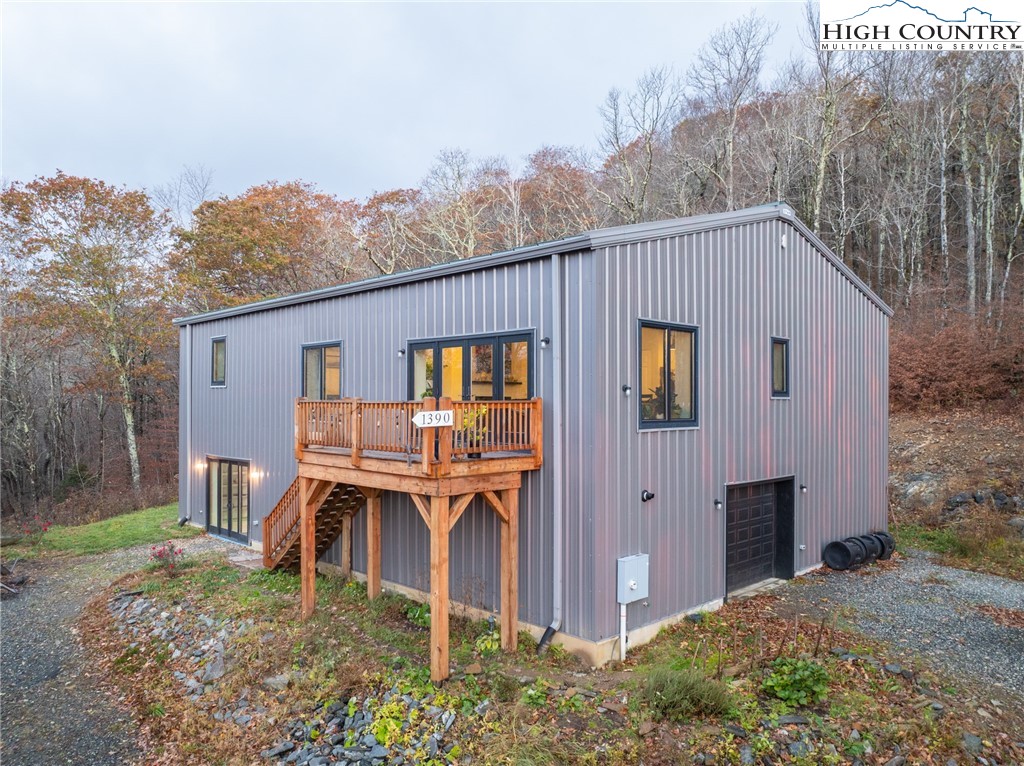 1390 Ransey Woodring Road Todd, NC 28684 - Photo 8 of 48 a front view of a house with garden
