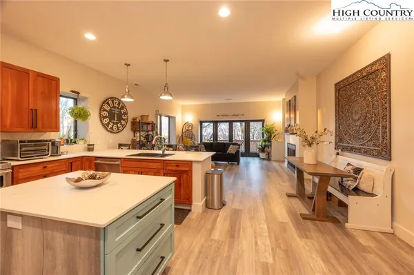 a kitchen with a table and chairs in it