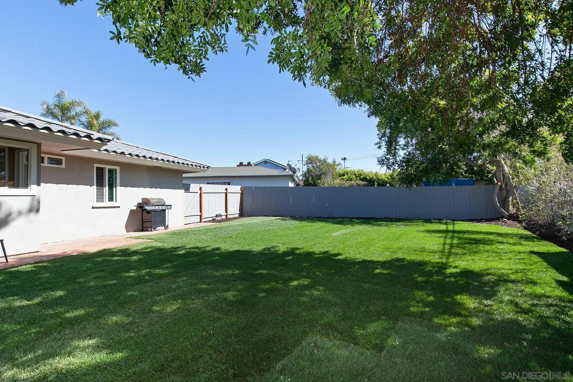 5238 La Jolla Boulevard San Diego, CA 92037 - Photo 23 of 46 a front view of a house with a yard and trees
